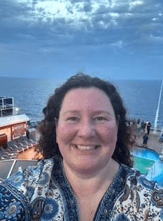 Stacy Hodgson on the deck of the Carnival Vista cruise ship at sea