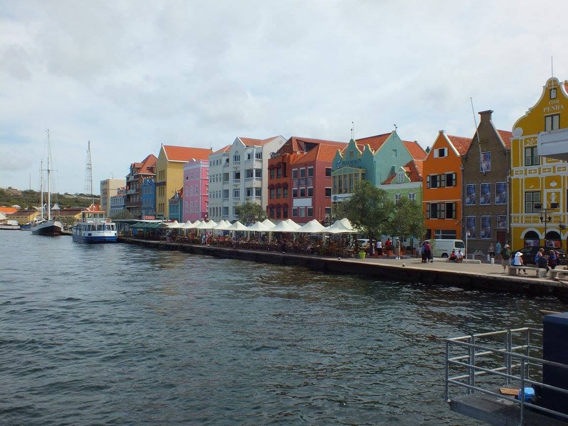 Colorful Dutch colonial architecture lining the waterfront of Willemstad, Curaçao